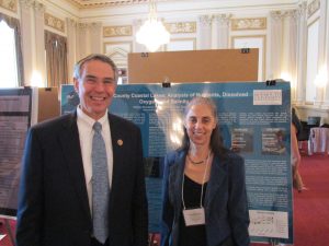 Former Rep. Rush Holt (NJ-12) and Dr. Ellen Rubenstein of Monmouth University with Dr. Rubenstein's poster about her analysis of local lakes presented at the 2014 NSCSE Washington Symposium Capitol Hill Poster Session